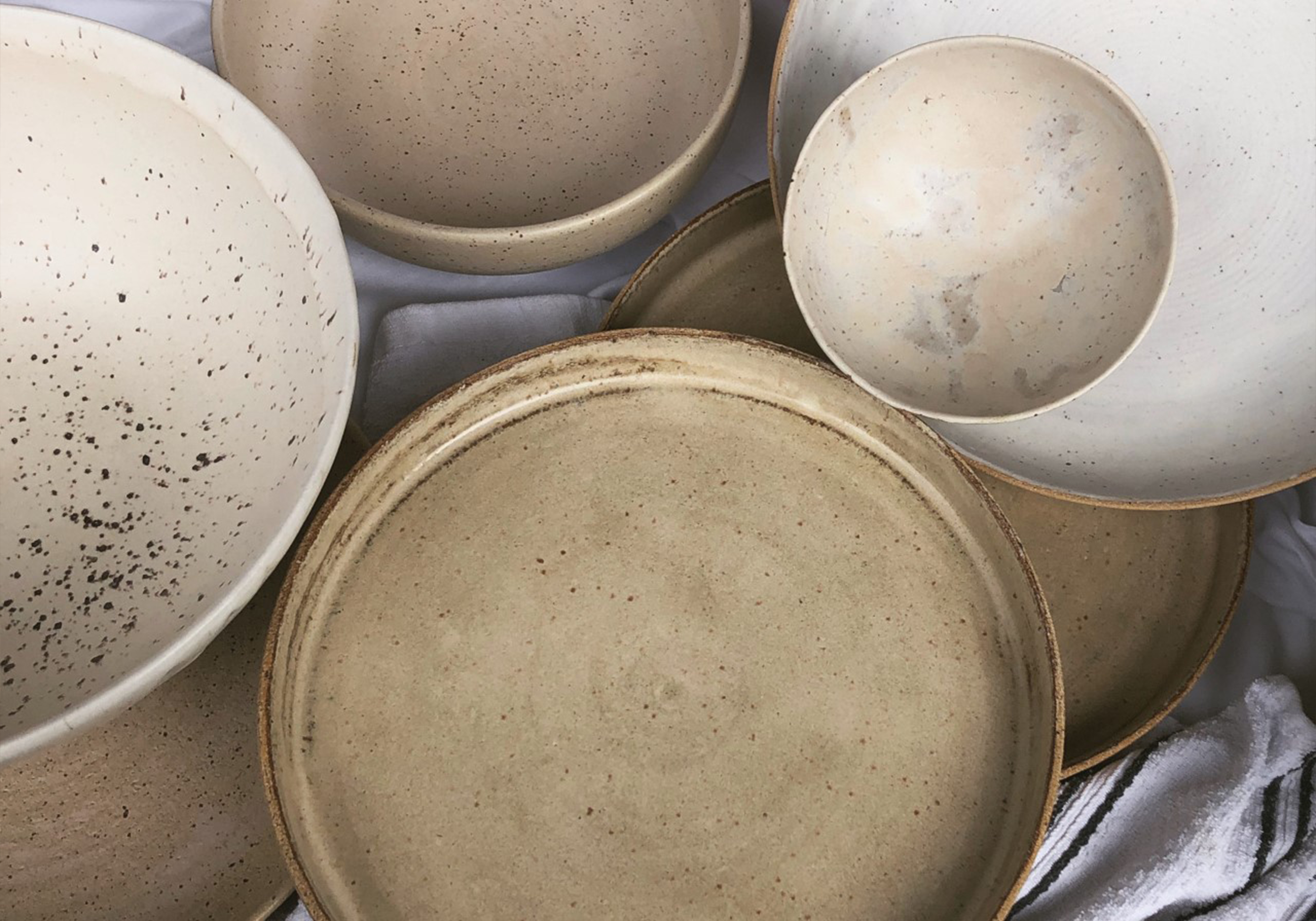 a collection of ceramic plates and bowls